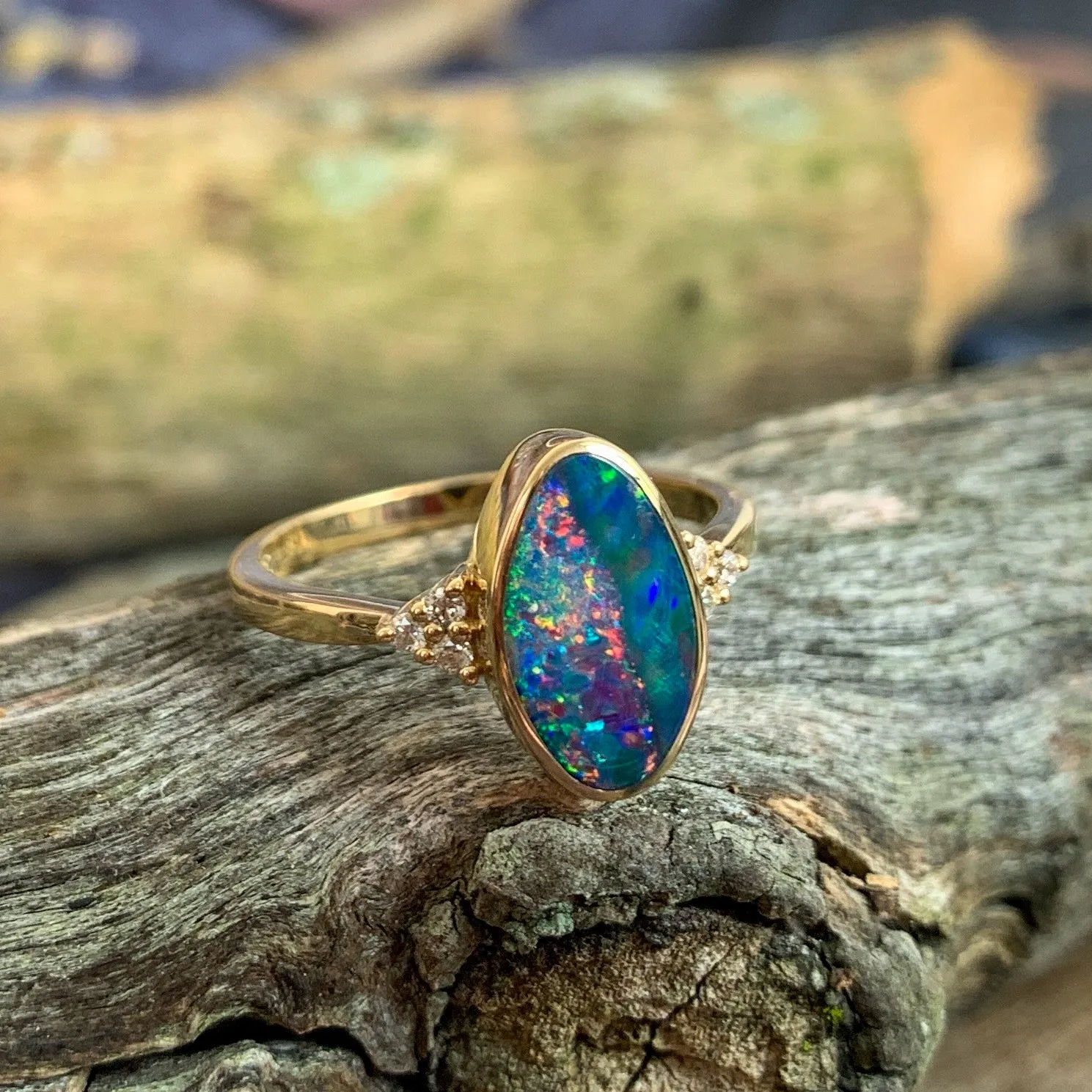 14kt Yellow Gold Oval freeform Red and Green Opal doublet with diamonds ring