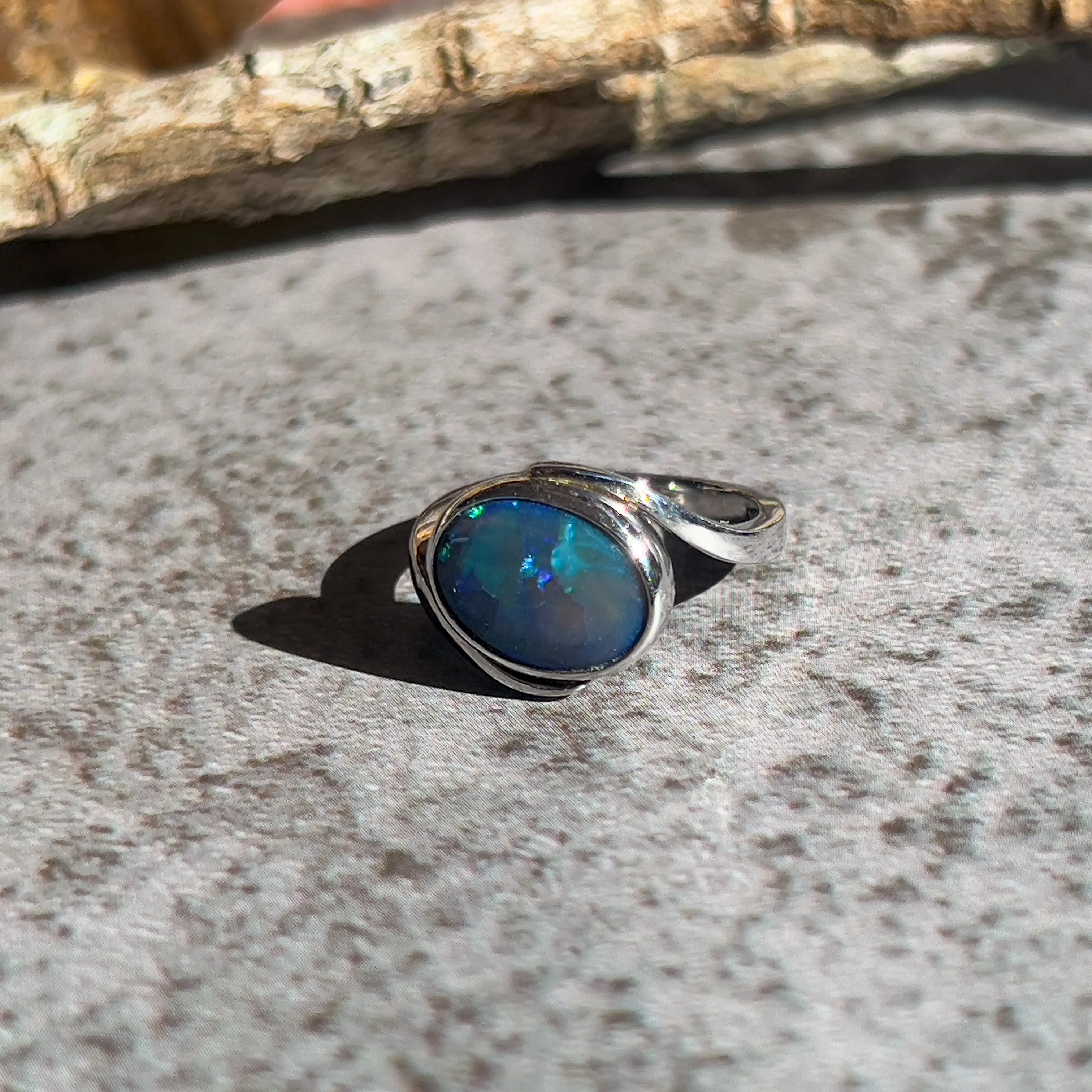 18kt White Gold cross over Black Opal 1.5ct Blue Green solitaire ring