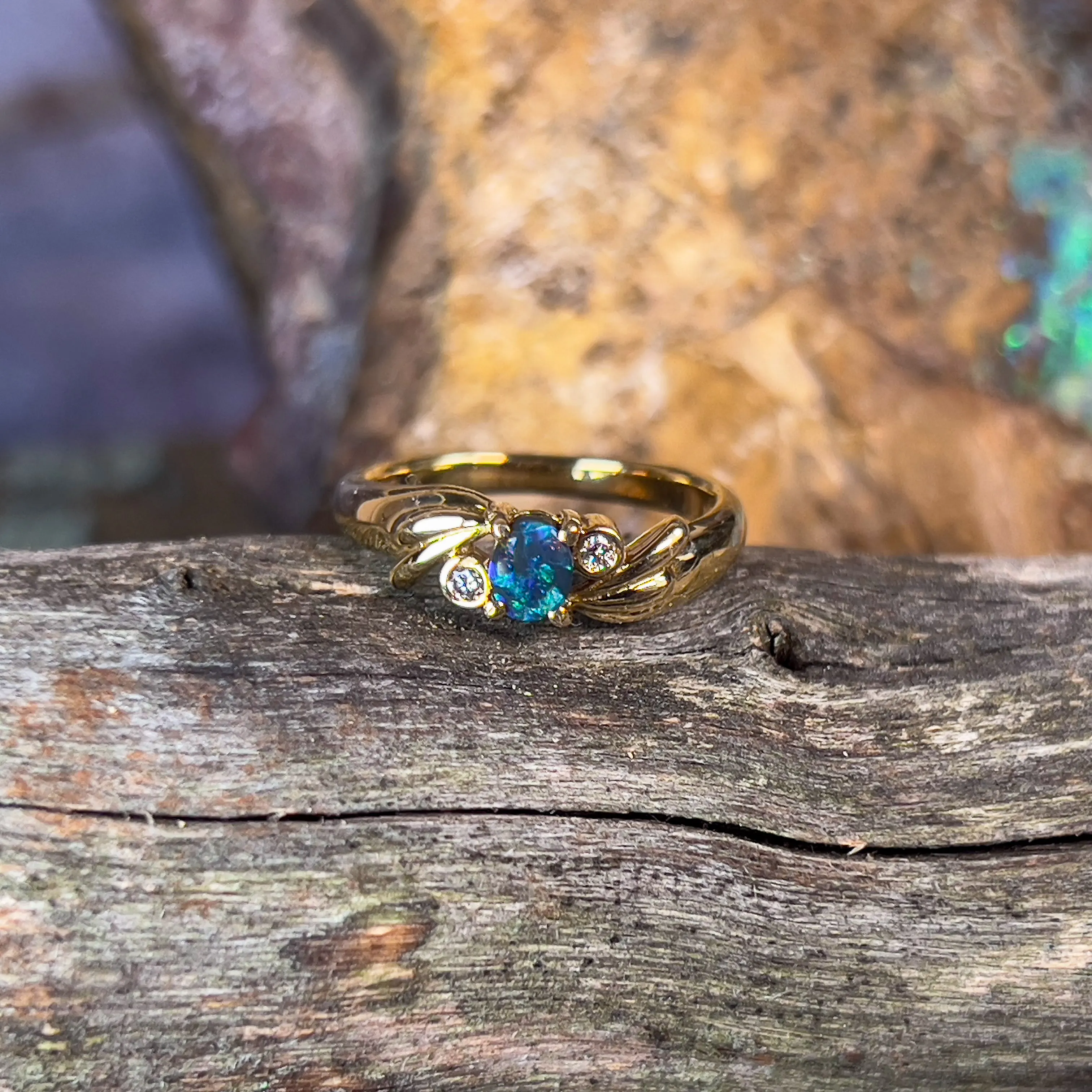 18kt Yellow Gold Black Opal 0.15 and Diamond ring