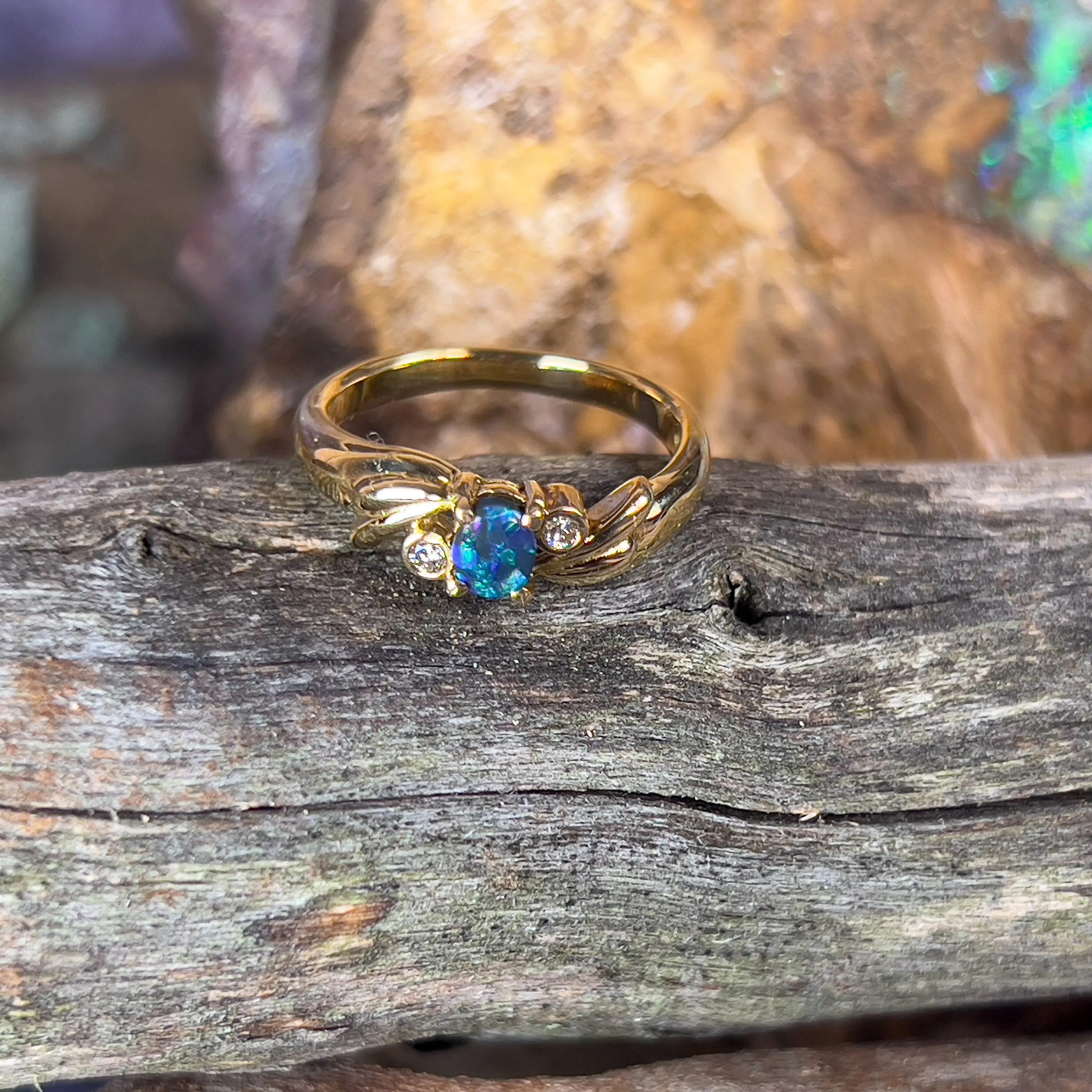 18kt Yellow Gold Black Opal 0.15 and Diamond ring